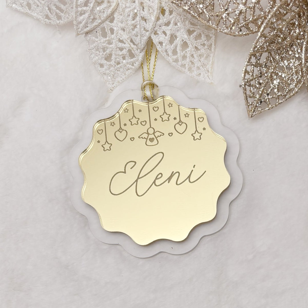 Double layered acrylic Christmas Ornament.   Personalised with a name of your choice, and engraved bunting of stars, hearts and an angel.