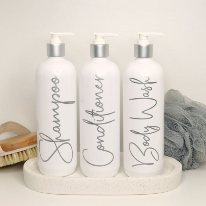 Shower gel pump bottles.  Shampoo and conditioner dispenser bottles for bathroom.