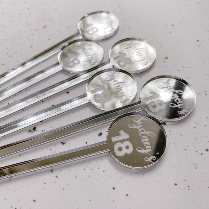 Personalised drink stirrers for your birthday party celebrations.  Customised with name and age and in a silver mirror acrylic material.