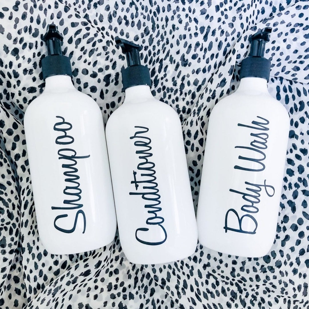 Empty shampoo bottles with pump for toiletries.